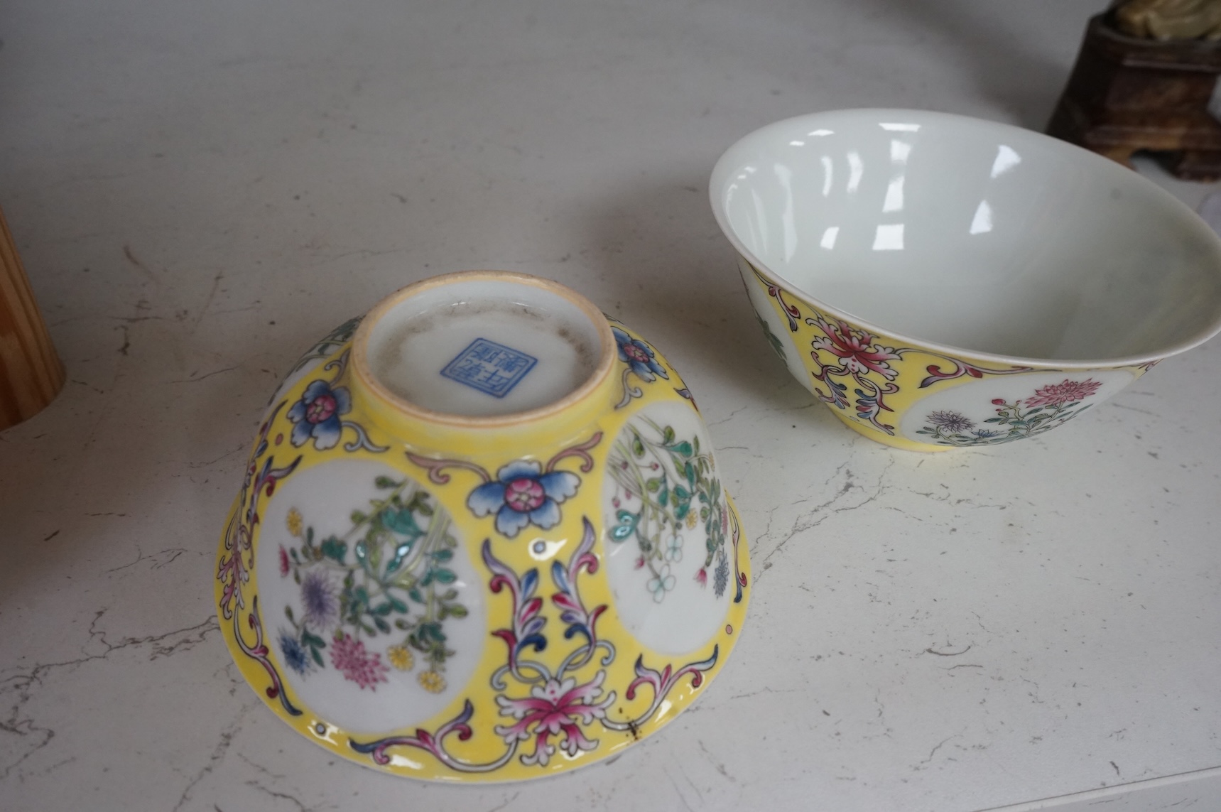 A pair of Chinese yellow ground medallion bowls, 13cm diameter